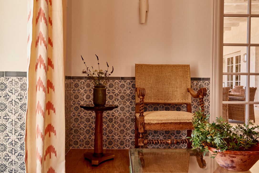 A quiet corner with antique chair and tiled walls